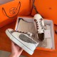 Hermes Velvet Sneakers In Blanc Calfskin With Printed Wing Patch