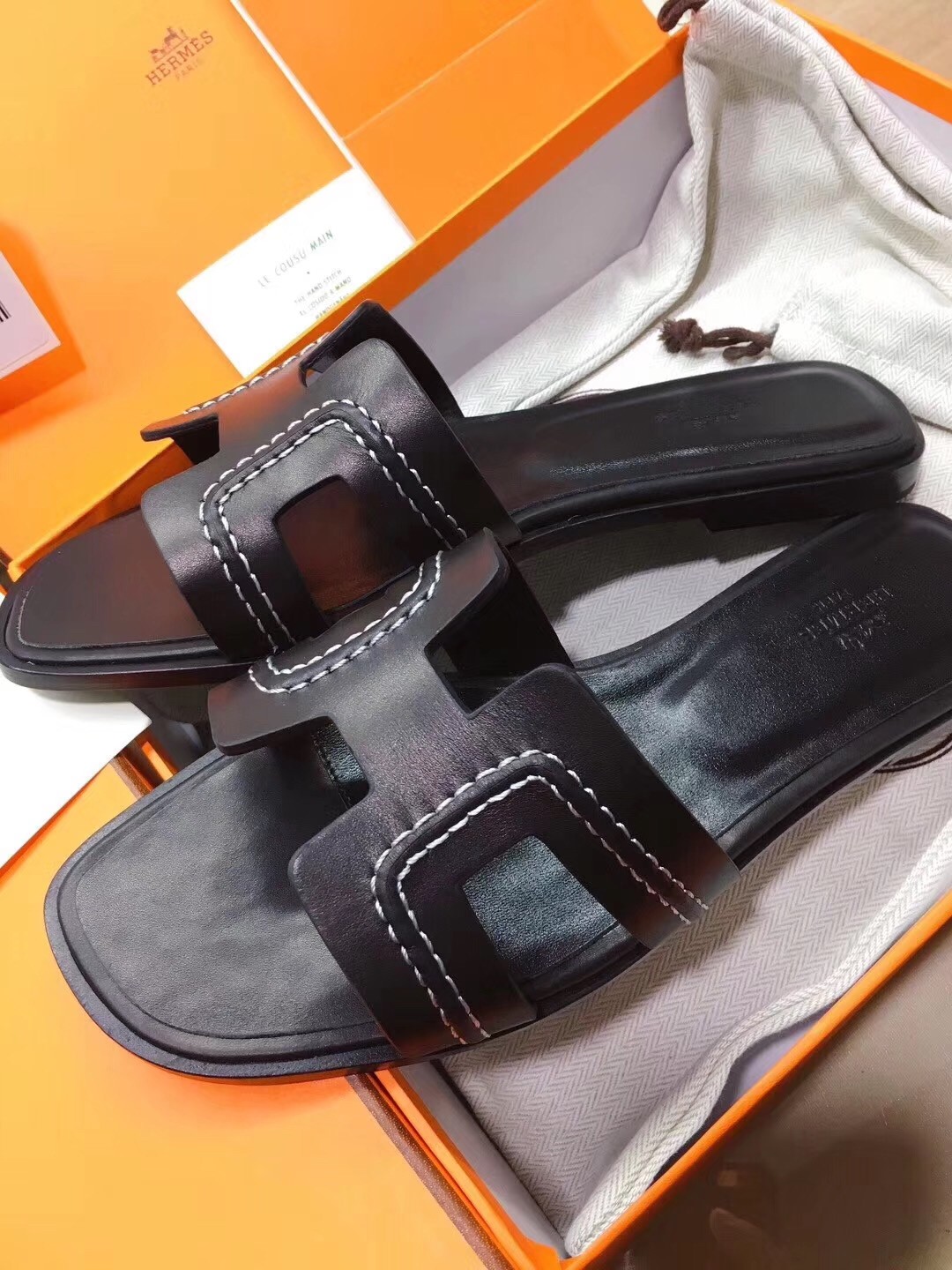Hermes Oran Sandals In Black Leather With Stitched Detail