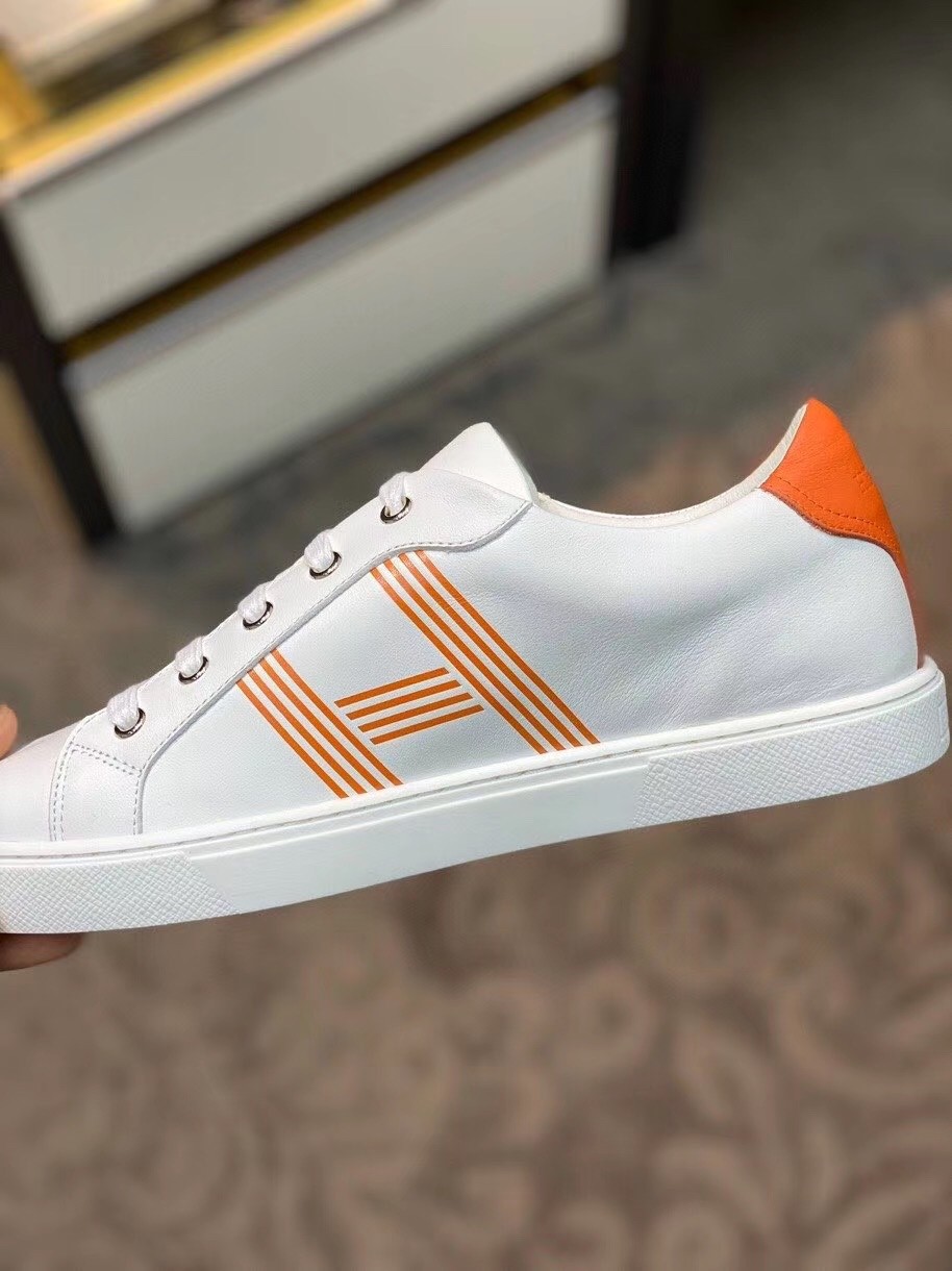 Hermes Avantage Sneakers In White/Orange Calfskin